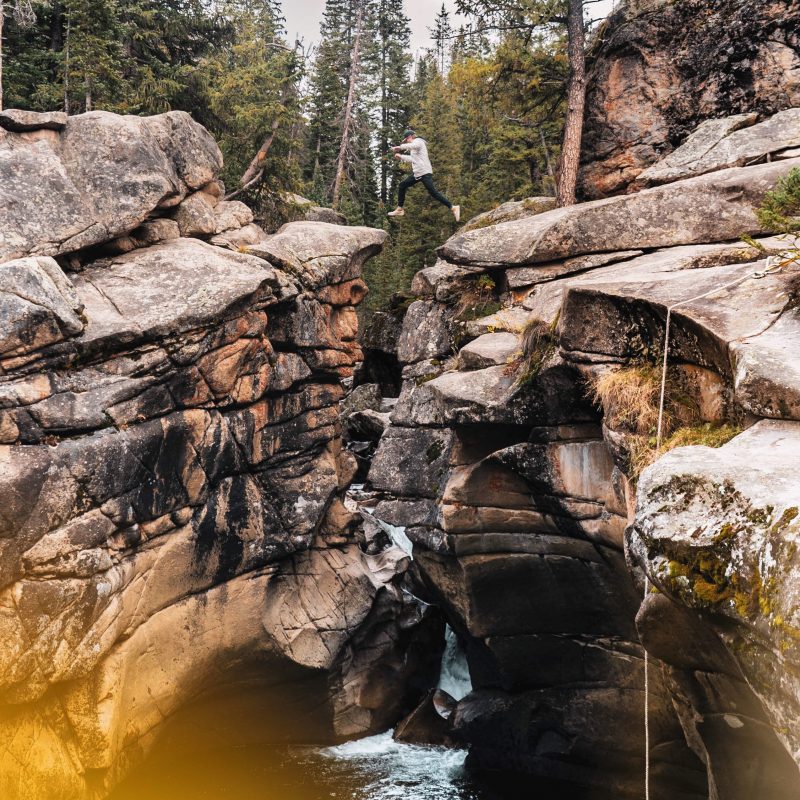 brown rocky mountain near river during daytime