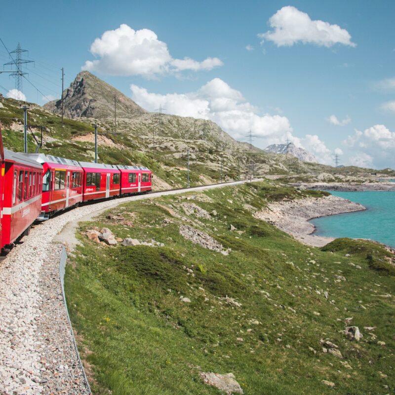 red train near lake