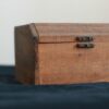 brown wooden chest box on black table