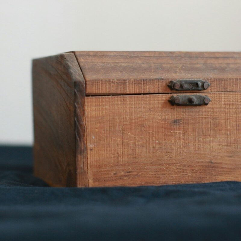 brown wooden chest box on black table