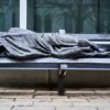 a bench that has a blanket on top of it
