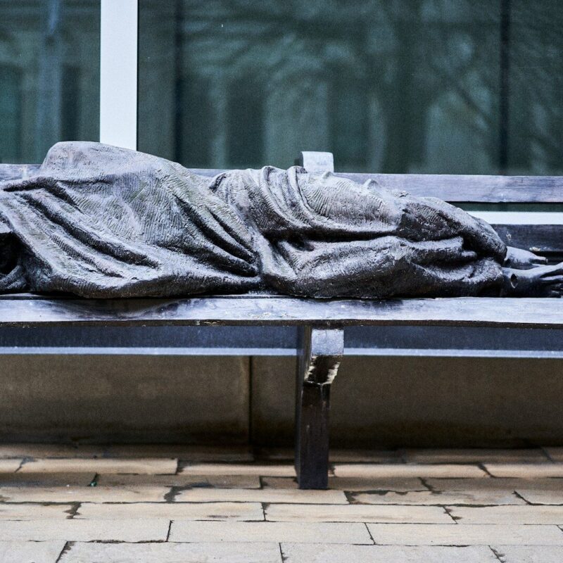 a bench that has a blanket on top of it